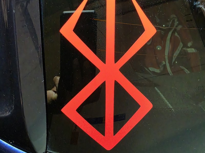 Red die-cut vinyl car window decal